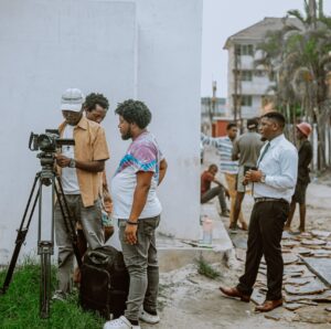 Film set in Jamaica with camera man and movie crew